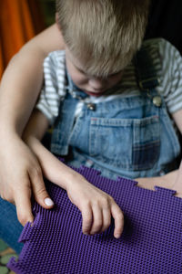 Mother playing with autistic son