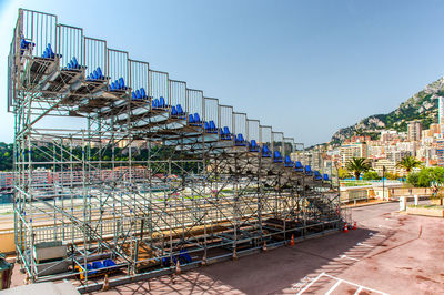 Row of built structure against clear blue sky