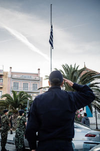 Rear view of man against sky