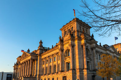 Low angle view of building against blue sky