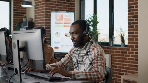 Man using desktop pc at office