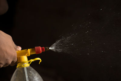 Close-up of person working in water