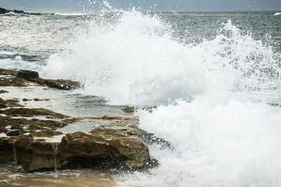 Waves breaking on rocks