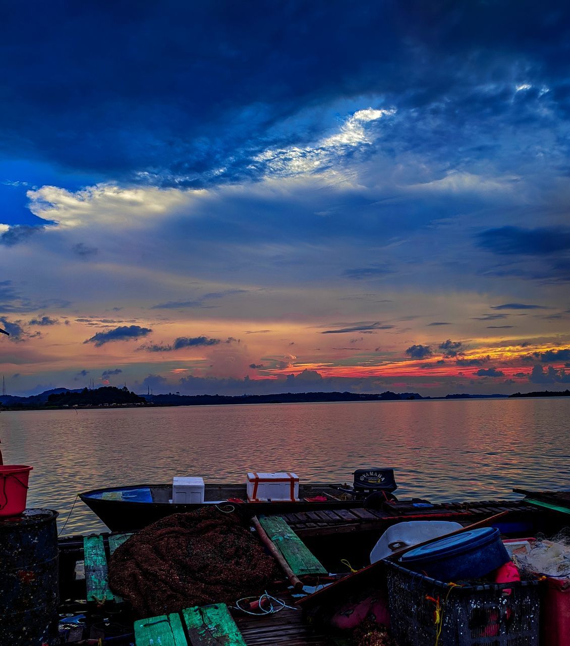SCENIC VIEW OF SEA AGAINST ORANGE SKY