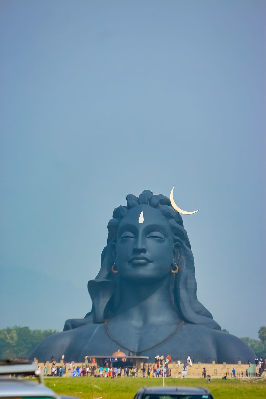 LOW ANGLE VIEW OF STATUES AGAINST BUILDING AGAINST CLEAR SKY