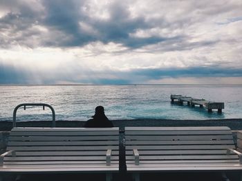 Meditating in front of the sea with no limit
