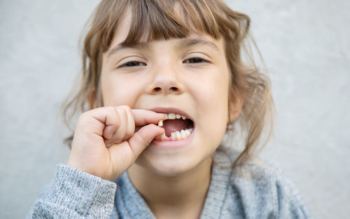 Portrait of smiling girl with broken tooth