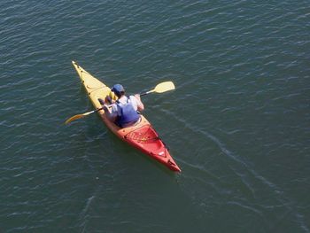 High angle view of man on boat in sea