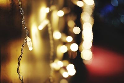 Close-up of illuminated christmas lights at night