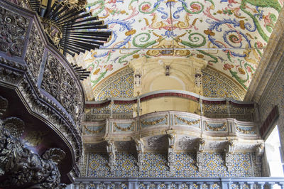 Low angle view of ornate ceiling of building
