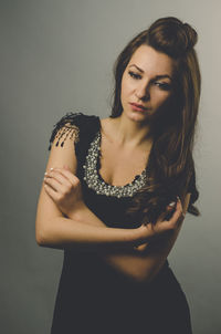 Portrait of a beautiful young woman over white background