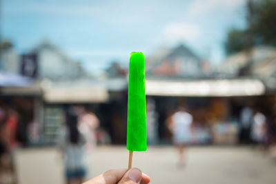 Close-up of hand holding ice cream