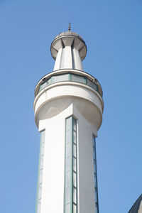 Low angle view of tower against blue sky