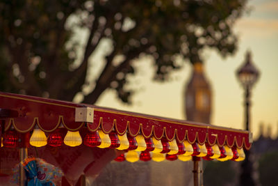 Colorful light bulbs hanging on roof