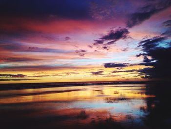 Scenic view of sea against dramatic sky