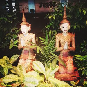 Statue of buddha against temple