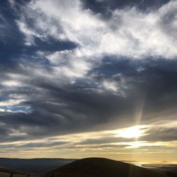 Scenic view of silhouette mountains against sky during sunset