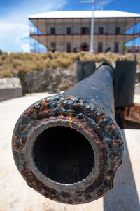 Close-up of rusty metal against sky