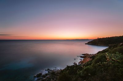 Scenic view of sea against sky during sunset