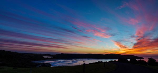 Scenic view of landscape against sky during sunset