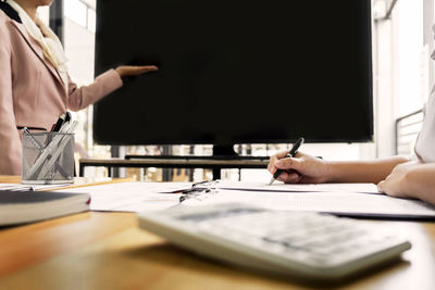 Close-up of hands working on table