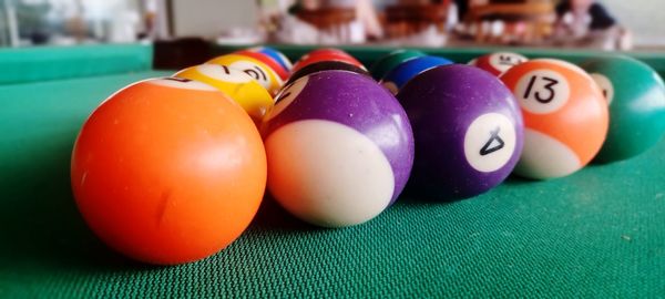 Close-up of multi colored balls on table