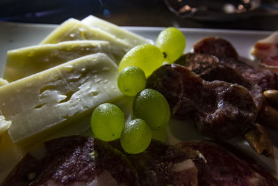 Close-up of fruits in plate on table