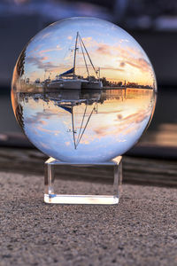 Bright crystal ball view of sunset over the boats in esplanade harbor marina in marco island, florid