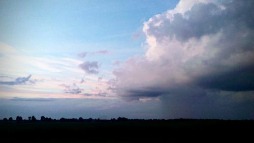 Silhouette landscape against sky during sunset