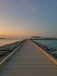 View of bridge over sea against sky during sunset