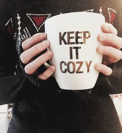 Close-up of hand with text