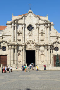 Group of people in front of historical building