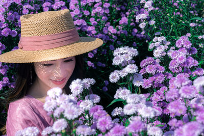 Portrait of woman with pink flowers