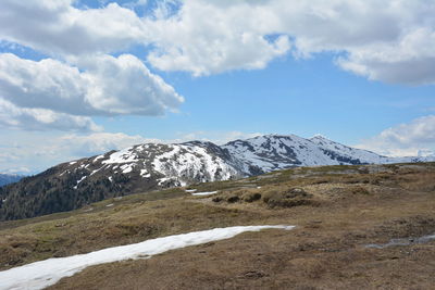 Scenic view of snowcapped mountains against sky