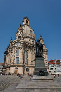 Low angle view of building against blue sky