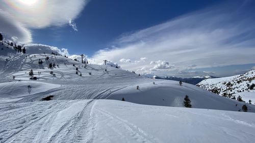 Scenic view of snowcapped mountains against sky