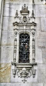 Low angle view of statue against building