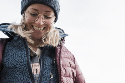 Close up portrait view of woman smiling whilst hiking