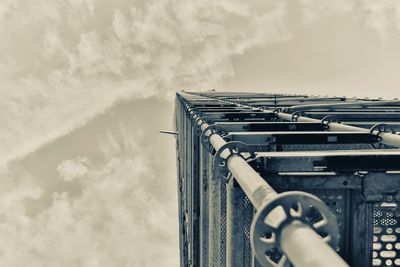 Low angle view of telephone pole against sky