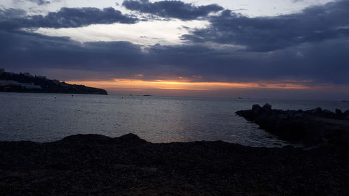 Scenic view of sea against sky during sunset