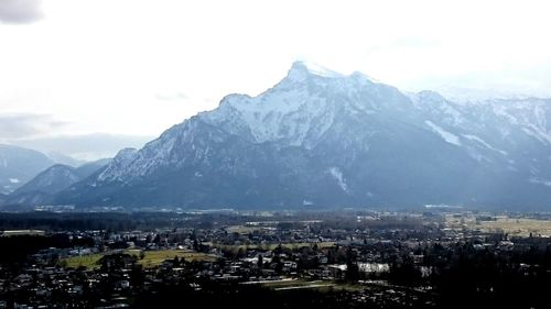 Cityscape with mountain range in background