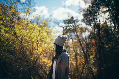 Rear view of a woman with umbrella