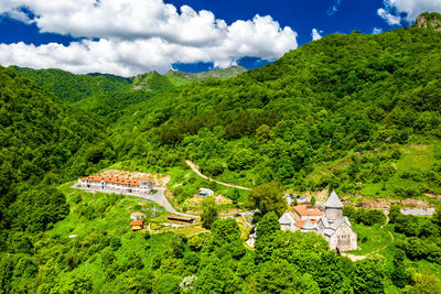 High angle view of trees and buildings against sky