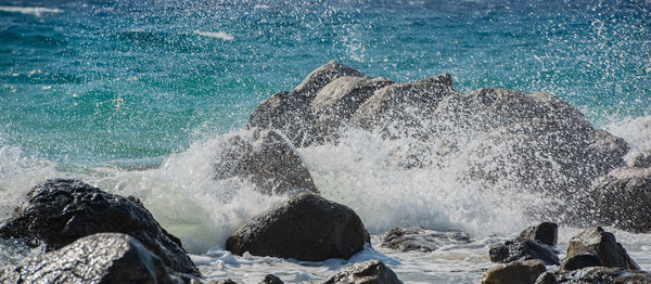 View of waves splashing on rocks