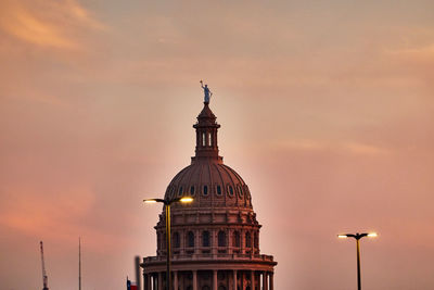 Low angle view of congress building against sky during sunset