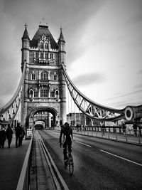 People walking on footbridge