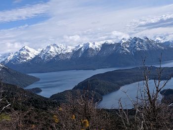 Scenic view of snowcapped mountains against sky