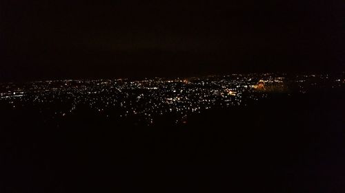 Illuminated cityscape at night