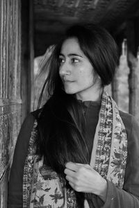 Portrait of beautiful young woman looking away