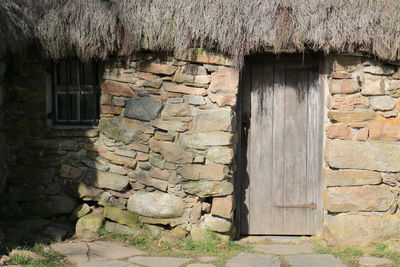 Brick wall with closed door